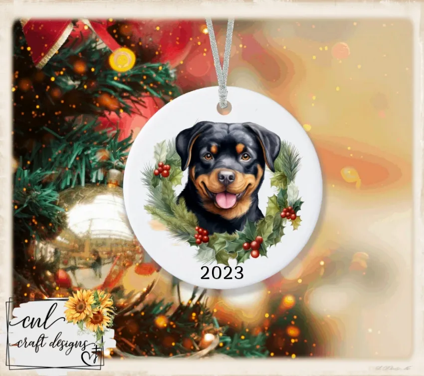 Ceramic ornament with a pet portrait in a holly wreath, dated 2023